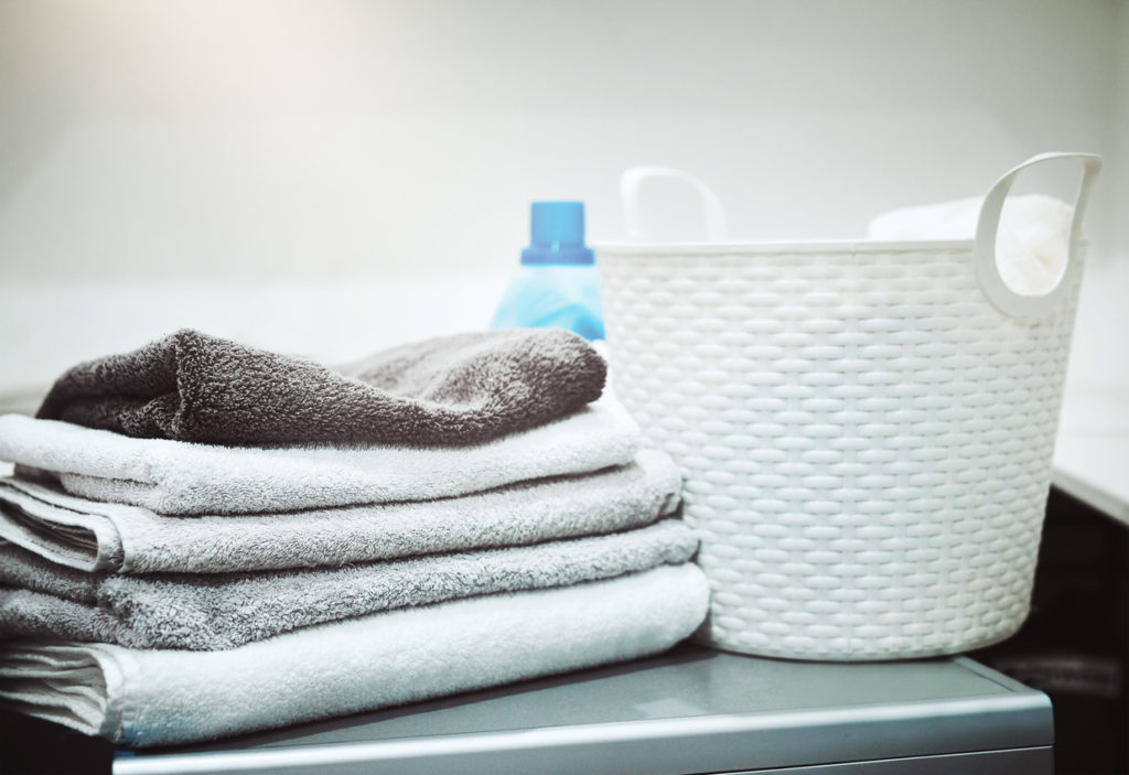 Clean folded towels in laundry room
