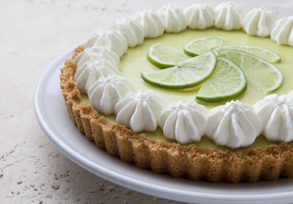 Key lime pie on a marble table.