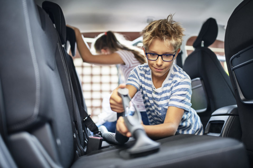 Kids cleaning car interior