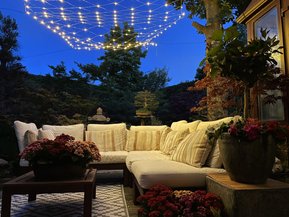 string lights outdoors over patio at night