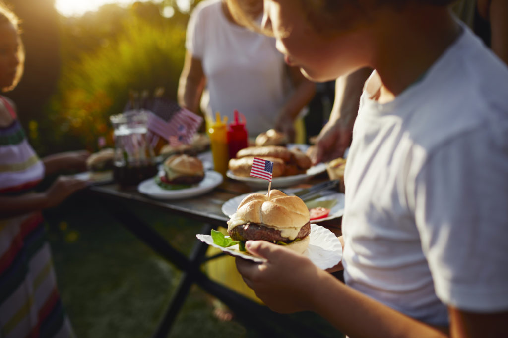 family eating food on fourth of july