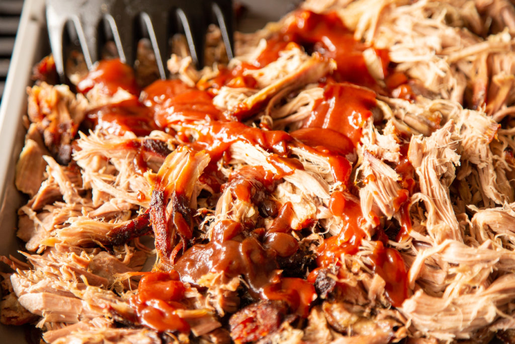 Pulled pork is prepared on the grill