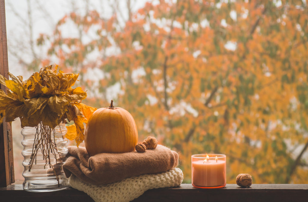 Still life details in home on a wooden window. Autumn decor on a window