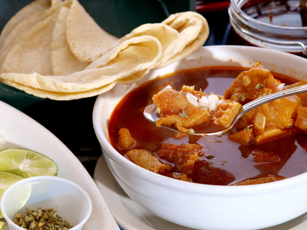 Fresh bowl of menudo with homemade tortillas